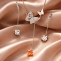 Moissanite earrings with amber necklace